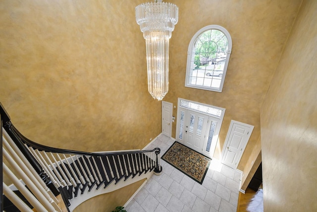 5N311 Lloyd Ave, Itasca, IL 60143 - foyer entrance featuring a chandelier, stairway, a towering ceiling, and tile patterned flooring