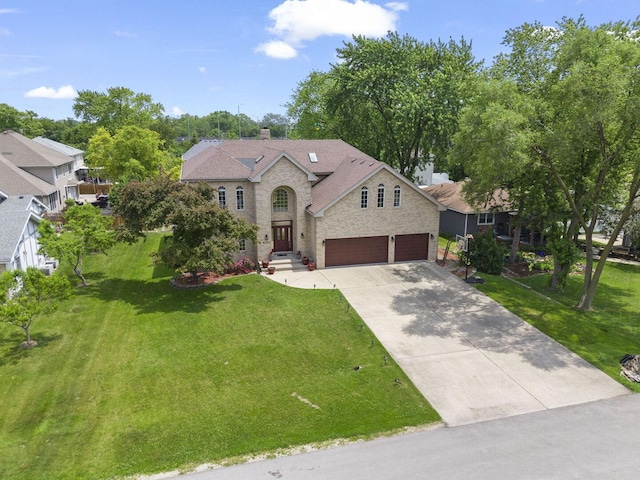 5N311 Lloyd Ave, Itasca, IL 60143 - view of front of home featuring concrete driveway, a front lawn, an attached garage, a shingled roof, and a chimney
