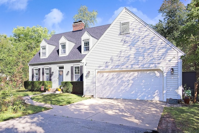 10726 W Liberty Ave, Beach Park, IL 60099 - cape cod-style house featuring concrete driveway, a garage, a chimney, a front yard, and roof with shingles