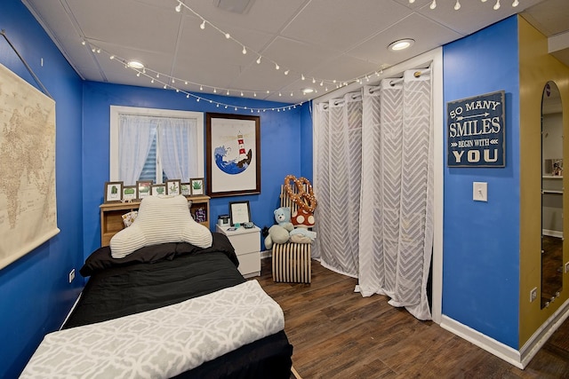 10726 W Liberty Ave, Beach Park, IL 60099 - bedroom featuring wood finished floors, track lighting, and baseboards