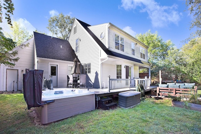 10726 W Liberty Ave, Beach Park, IL 60099 - rear view of house with a deck, a hot tub, a yard, and an outdoor living space