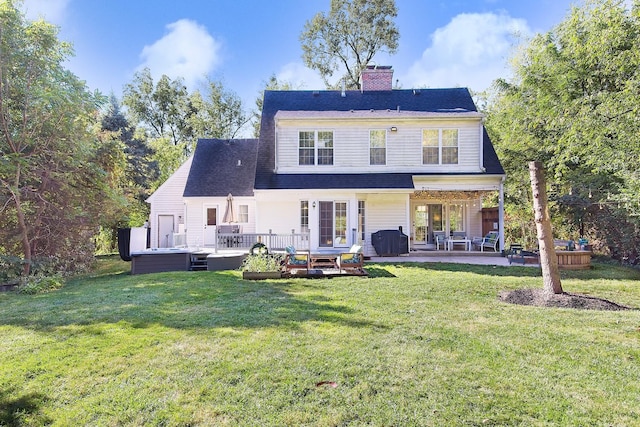 10726 W Liberty Ave, Beach Park, IL 60099 - rear view of property with a lawn, a chimney, and a wooden deck