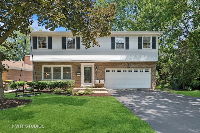 567 Byrd Rd, Riverside, IL 60546 - view of front of property with asphalt driveway, an attached garage, a front lawn, and brick siding