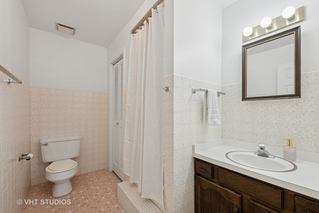 567 Byrd Rd, Riverside, IL 60546 - full bathroom with tile walls, vanity, a wainscoted wall, tile patterned flooring, and a shower with curtain