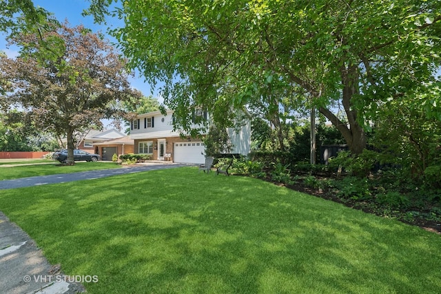 567 Byrd Rd, Riverside, IL 60546 - view of front facade featuring driveway, an attached garage, and a front yard