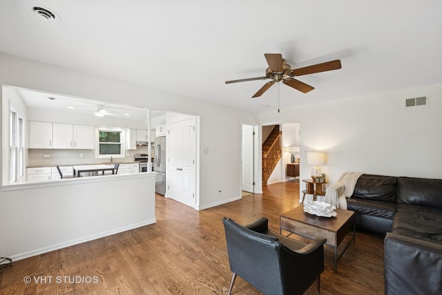 567 Byrd Rd, Riverside, IL 60546 - living room with ceiling fan, stairs, and wood finished floors