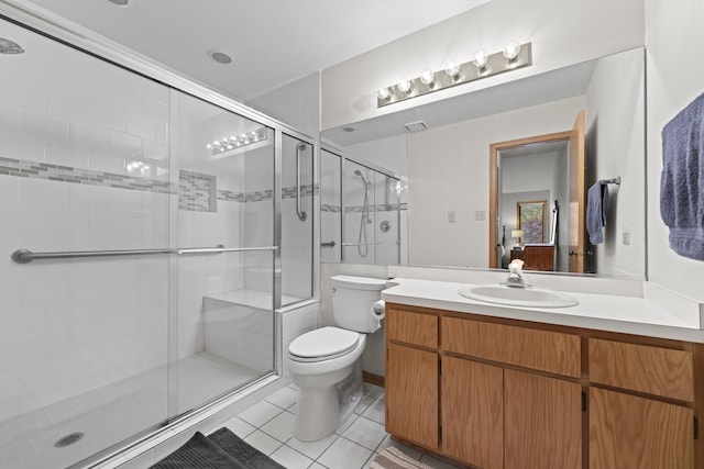 11234 Lakefield Dr, Orland Park, IL 60467 - full bathroom featuring toilet, vanity, a stall shower, and tile patterned flooring