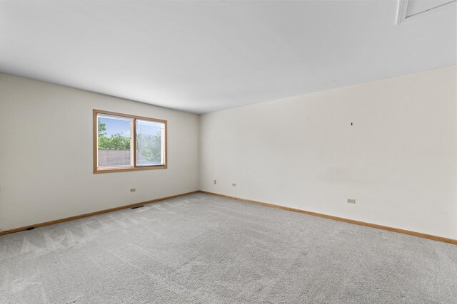 11234 Lakefield Dr, Orland Park, IL 60467 - spare room with baseboards and light carpet
