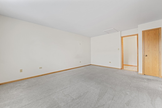 11234 Lakefield Dr, Orland Park, IL 60467 - empty room featuring baseboards, light carpet, and attic access