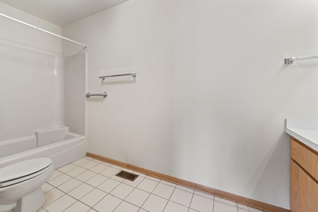 11234 Lakefield Dr, Orland Park, IL 60467 - full bath featuring vanity, shower / washtub combination, toilet, baseboards, and tile patterned flooring