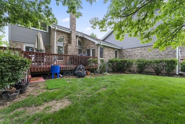 11234 Lakefield Dr, Orland Park, IL 60467 - view of grassy yard with a deck