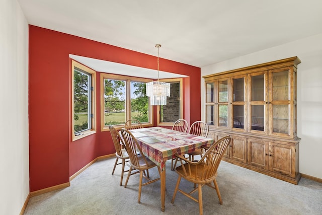 11234 Lakefield Dr, Orland Park, IL 60467 - dining space featuring a chandelier, baseboards, and light carpet