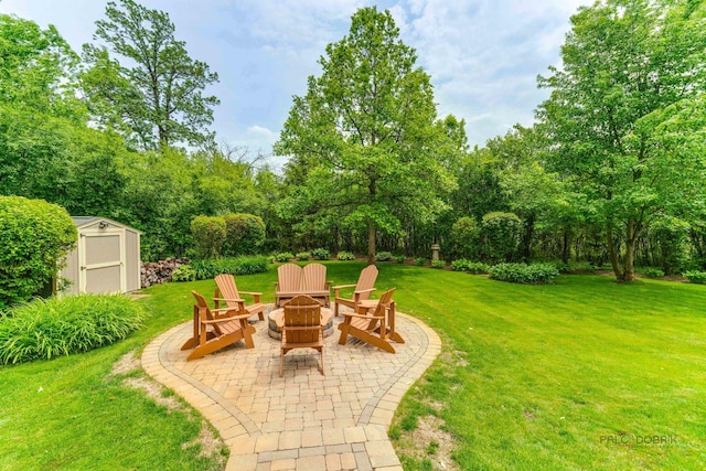 1602 Wickham Ct, Libertyville, IL 60048 - view of grassy yard with a fire pit, a shed, a patio, and view of scattered trees