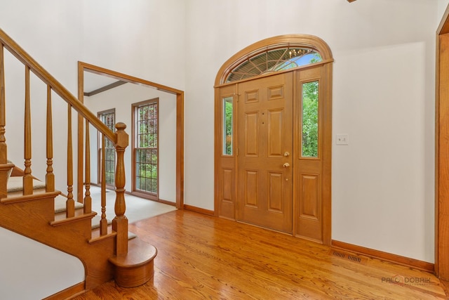 1602 Wickham Ct, Libertyville, IL 60048 - entrance foyer with light wood-style floors, stairs, and a towering ceiling