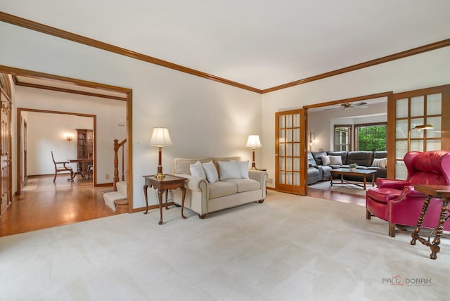 1602 Wickham Ct, Libertyville, IL 60048 - carpeted living area featuring french doors, crown molding, a ceiling fan, and stairs