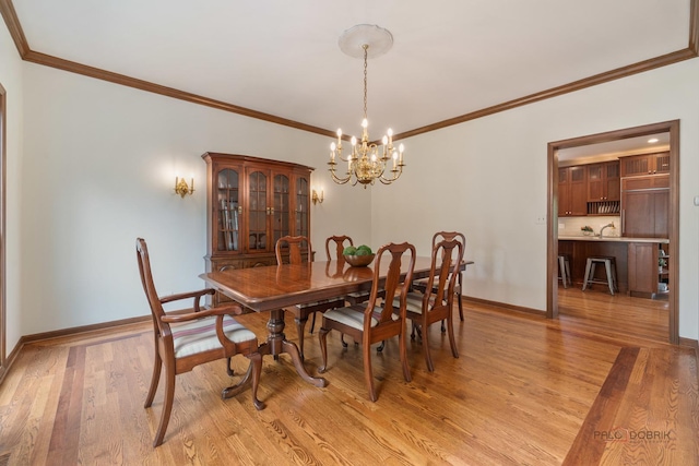 1602 Wickham Ct, Libertyville, IL 60048 - dining space featuring a chandelier, light wood-style floors, and crown molding