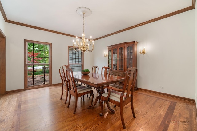 1602 Wickham Ct, Libertyville, IL 60048 - dining room featuring a chandelier, light wood-style floors, and ornamental molding