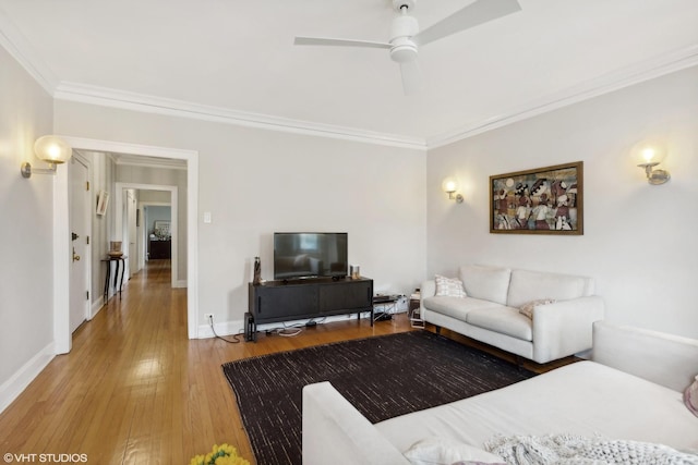 5842 N Wayne Ave Unit 1, Chicago, IL 60660 - living room featuring crown molding, a ceiling fan, light wood-style floors, and baseboards