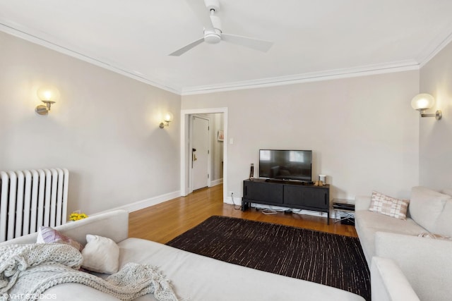 5842 N Wayne Ave Unit 1, Chicago, IL 60660 - living area with ornamental molding, radiator, wood finished floors, ceiling fan, and baseboards