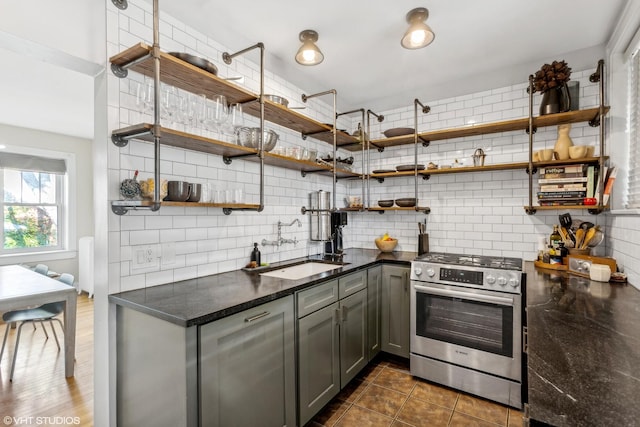 5842 N Wayne Ave Unit 1, Chicago, IL 60660 - kitchen with stainless steel gas stove, tasteful backsplash, open shelves, gray cabinets, and a sink