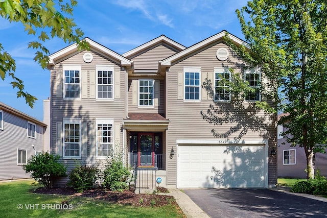 6542 Pine Hollow Rd, Carpentersville, IL 60110 - traditional-style home featuring driveway and a garage