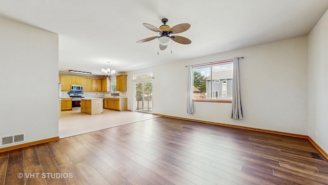 6542 Pine Hollow Rd, Carpentersville, IL 60110 - unfurnished living room with a chandelier, a ceiling fan, and light wood-style flooring