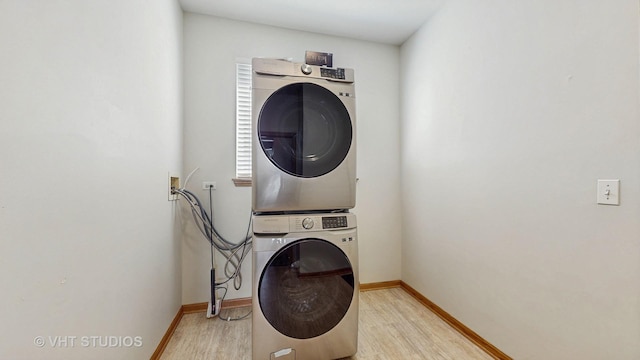 6542 Pine Hollow Rd, Carpentersville, IL 60110 - washroom featuring stacked washer / drying machine and light wood-type flooring