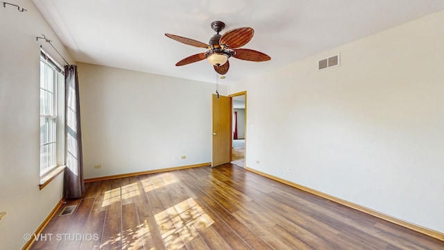 6542 Pine Hollow Rd, Carpentersville, IL 60110 - spare room with healthy amount of natural light, wood finished floors, and a ceiling fan