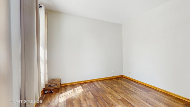 6542 Pine Hollow Rd, Carpentersville, IL 60110 - spare room with wood finished floors and baseboards