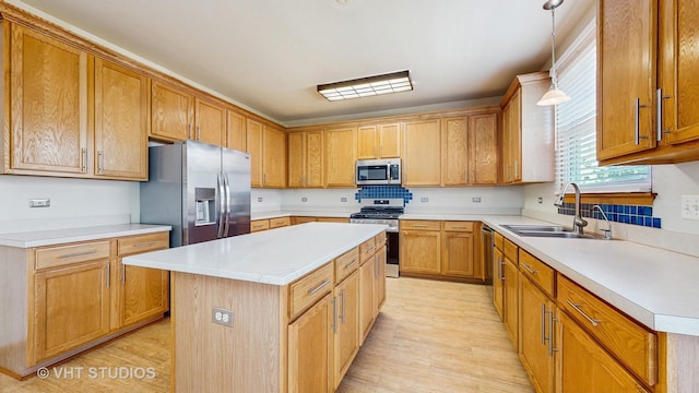 6542 Pine Hollow Rd, Carpentersville, IL 60110 - kitchen with appliances with stainless steel finishes, light countertops, a center island, light wood finished floors, and pendant lighting