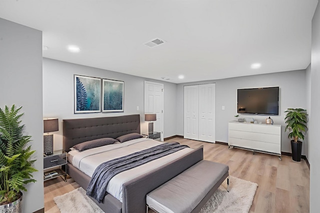 7827 S Calumet Ave, Chicago, IL 60619 - bedroom with recessed lighting, light wood-type flooring, a closet, and baseboards