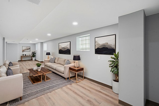 7827 S Calumet Ave, Chicago, IL 60619 - living room with light wood finished floors, baseboards, and recessed lighting