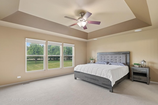 18861 W Aspen Ct, Lake Villa, IL 60046 - carpeted bedroom featuring a raised ceiling and a ceiling fan