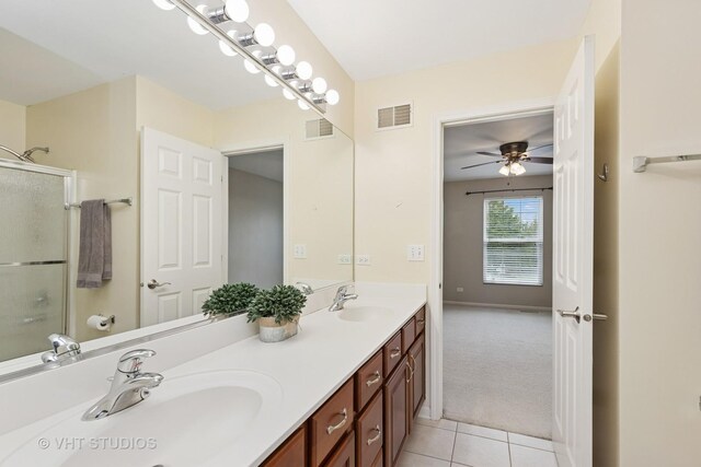 18861 W Aspen Ct, Lake Villa, IL 60046 - full bathroom featuring double vanity, tile patterned flooring, a ceiling fan, and a shower with door
