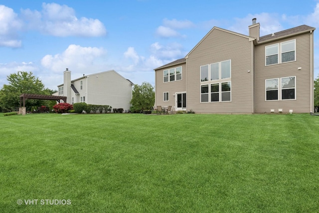 18861 W Aspen Ct, Lake Villa, IL 60046 - rear view of property featuring a yard, a chimney, and a pergola