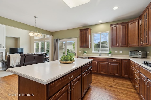 18861 W Aspen Ct, Lake Villa, IL 60046 - kitchen featuring light countertops, wood finished floors, a chandelier, recessed lighting, and a center island