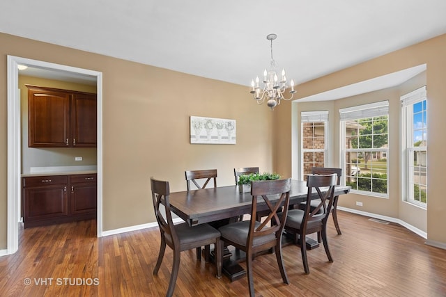 18861 W Aspen Ct, Lake Villa, IL 60046 - dining room featuring wood finished floors and a chandelier