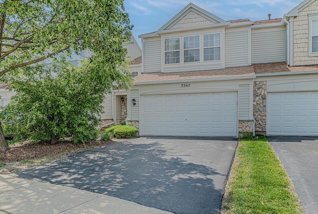 2367 Camden Bay, Elgin, IL 60123 - townhome / multi-family property with stone siding, asphalt driveway, roof with shingles, and an attached garage