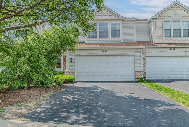 2367 Camden Bay, Elgin, IL 60123 - multi unit property featuring stone siding, asphalt driveway, a shingled roof, and a garage