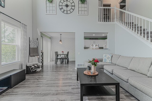 2367 Camden Bay, Elgin, IL 60123 - living area with a high ceiling, wood finished floors, and stairs