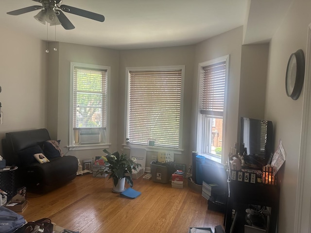 7127 S Eberhart Ave, Chicago, IL 60619 - living room with plenty of natural light, wood finished floors, a ceiling fan, and cooling unit