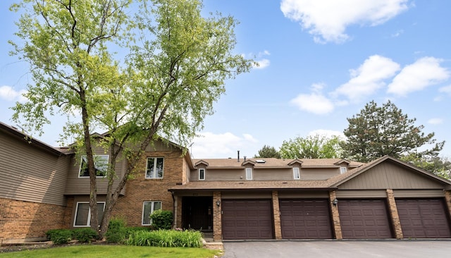972 W Ct Unit C, Naperville, IL 60563 - view of front of house with brick siding, an attached garage, roof with shingles, and asphalt driveway