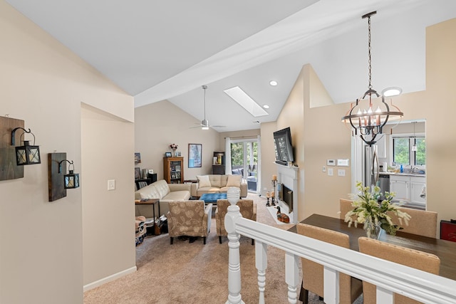 972 W Ct Unit C, Naperville, IL 60563 - living area featuring high vaulted ceiling, light carpet, healthy amount of natural light, a glass covered fireplace, and a ceiling fan