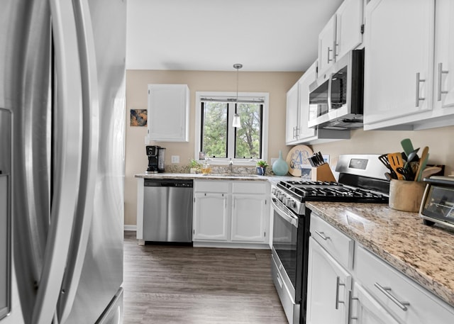 972 W Ct Unit C, Naperville, IL 60563 - kitchen featuring stainless steel appliances, a sink, white cabinets, dark wood finished floors, and light stone counters