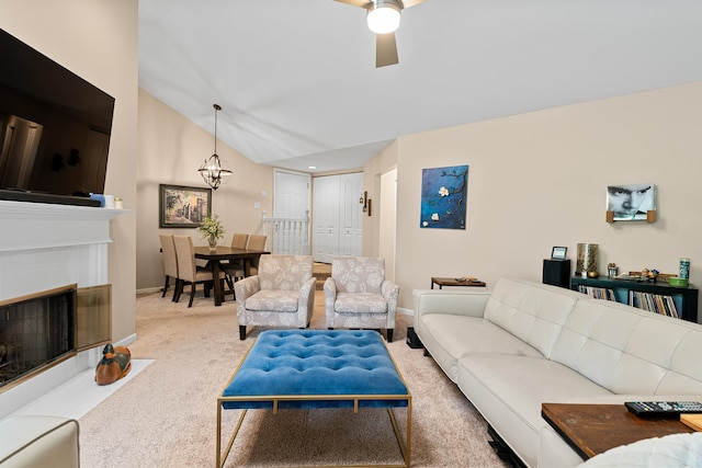 972 W Ct Unit C, Naperville, IL 60563 - carpeted living room featuring baseboards, a chandelier, a ceiling fan, lofted ceiling, and a fireplace
