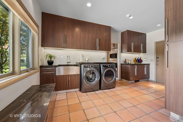 1242 Antietam Dr, Long Grove, IL 60047 - laundry room featuring washing machine and dryer, cabinet space, light tile patterned floors, and recessed lighting