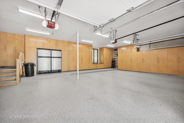 1242 Antietam Dr, Long Grove, IL 60047 - garage featuring a garage door opener and freestanding refrigerator