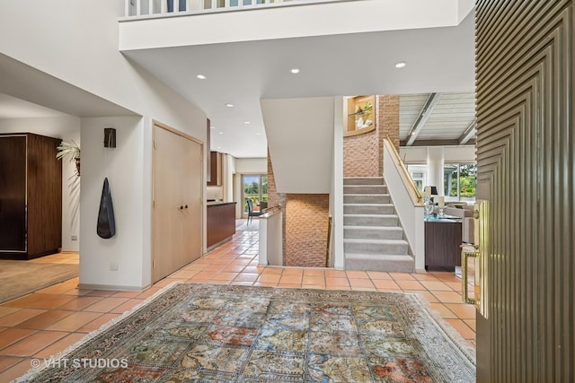 1242 Antietam Dr, Long Grove, IL 60047 - entryway with light tile patterned floors, stairway, and recessed lighting