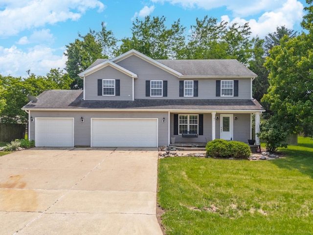 102 Merganser Ct, Downs, IL 61736 - view of front facade with driveway, a front yard, a porch, and an attached garage