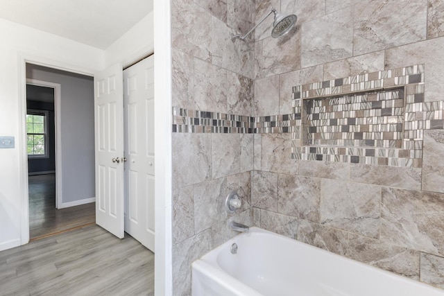 102 Merganser Ct, Downs, IL 61736 - bathroom featuring wood finished floors, shower / bath combination, and baseboards